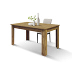 Tavolo Era, vista 3/4 con una sedia beige e vasi decorativi