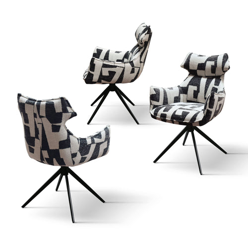 Poltrona girevole Aurora in tessuto fantasia geometrica bianco e nero, base in metallo nero
