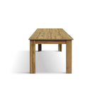 Tavolo Giunone, vista 3/4 con una sedia beige e vasi decorativi
